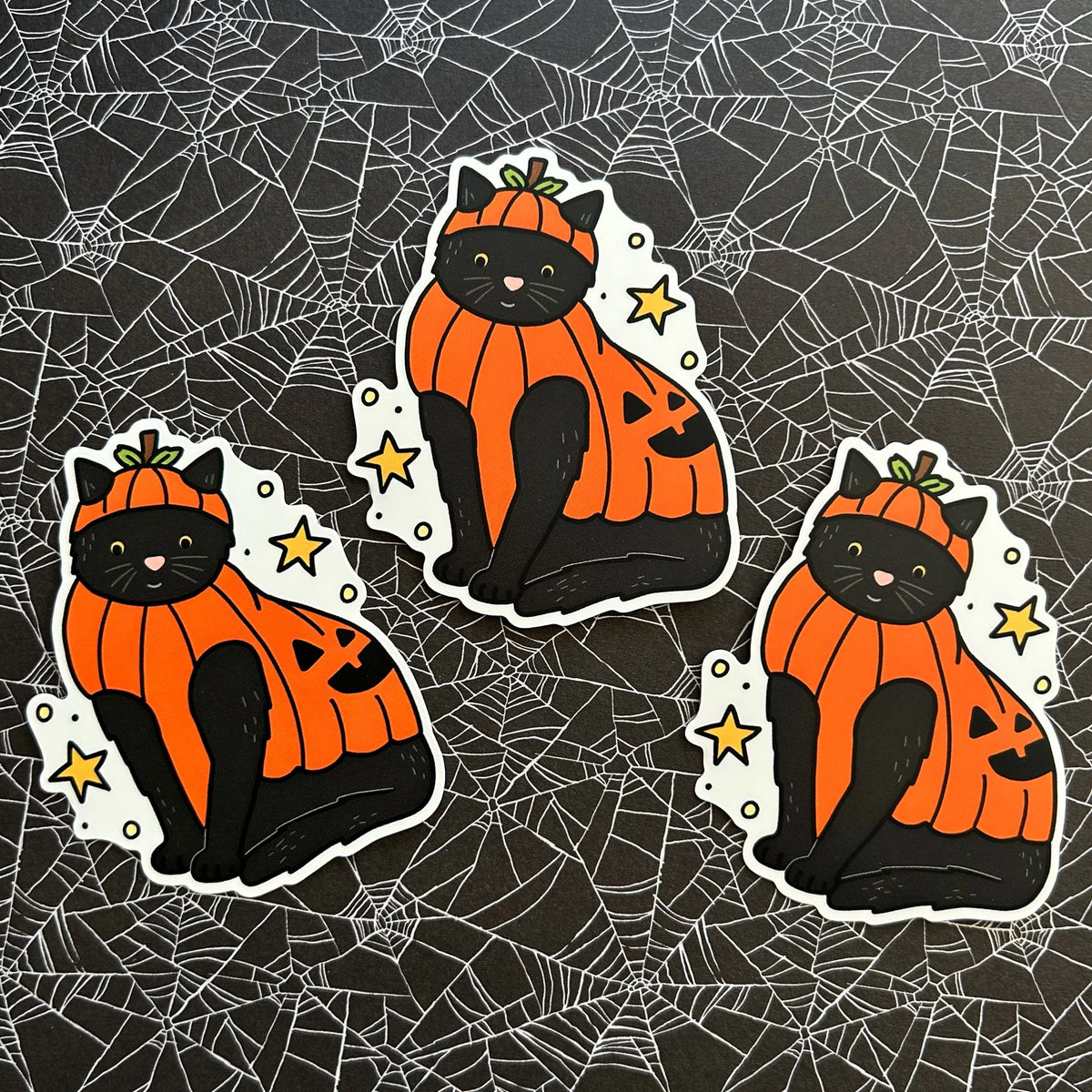 Little Spooky Studio - Beanie Pumpkin Cat Vinyl Sticker
A black cat wearing a pumpkin costume :)