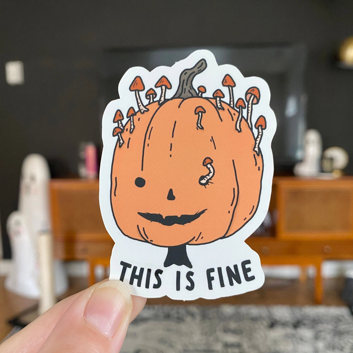 Little Spooky Studio - This Is Fine Pumpkin Vinyl Sticker
3 inch matte sticker of a rotting mushroomy pumpkin with the text "This is fine." underneath.