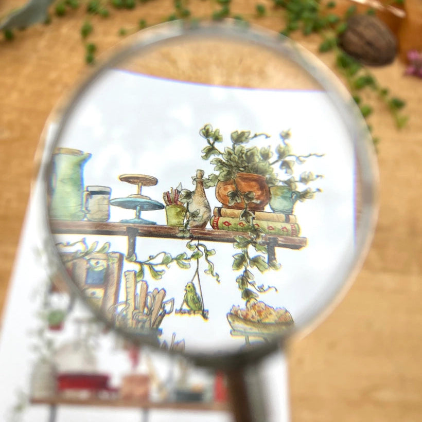 Postcard featuring my original watercolor and ink illustration of the vintage oddities and books tucked away in the shelves of a potter, including glaze test tiles, a tiny kiln, and a bowl of sponges.