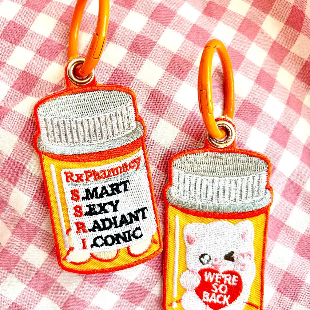 These cute embroidered keychains attach with a colorful ring clasp and are perfect for attaching to your keys or bag to bring with you on all of your adventures! This design features extra grommets to hang more keychains and knick knacks!
Includes one keychain only.
Embroidered on both sides. The keychain is double sided with different artwork on each side as pictured.
Materials: Cotton, Polyester, Brass