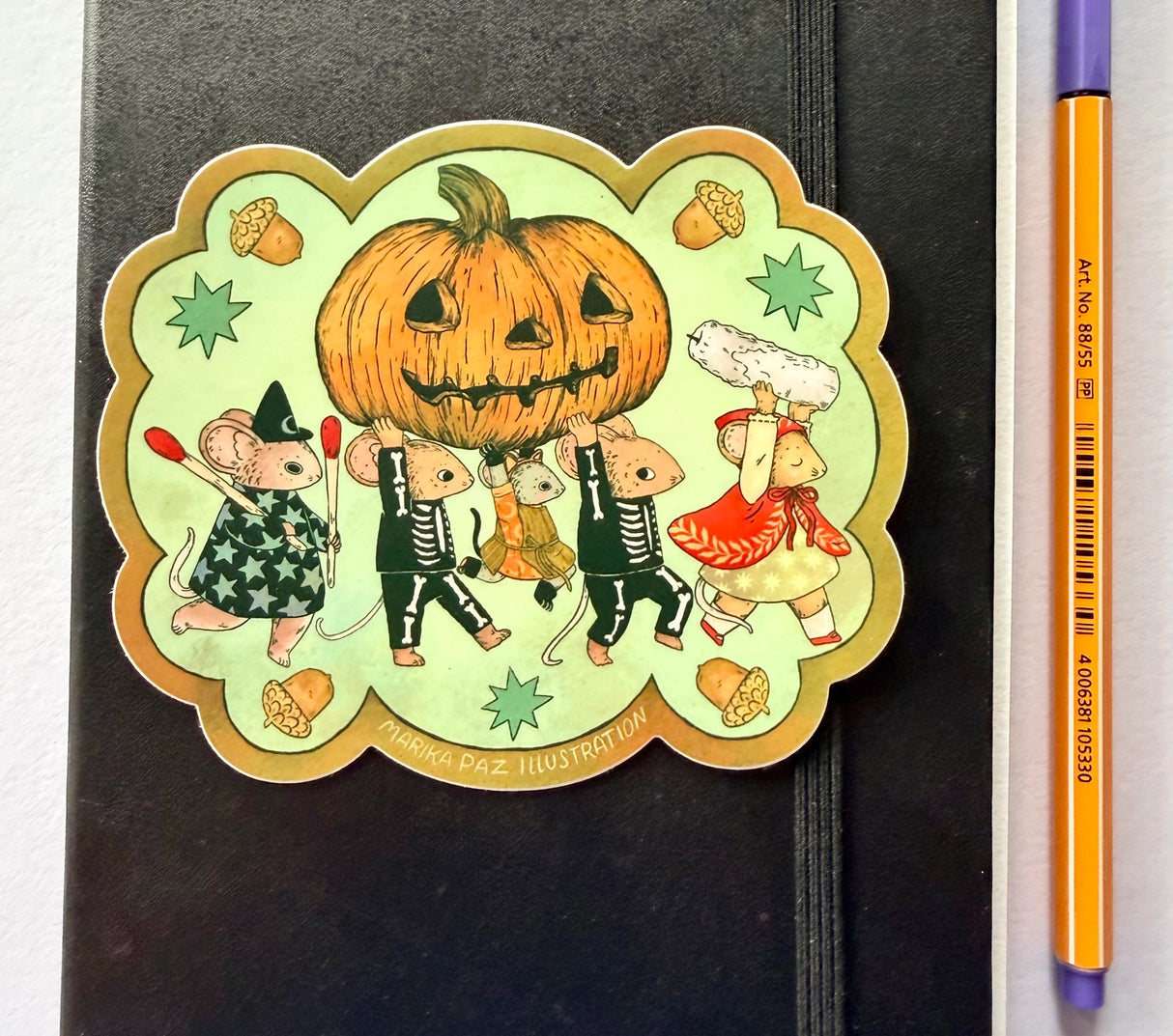 A halloween parade brings out the Jack-o-lantern!
This vinyl matte sticker is weather and waterproof-stick it on a notebook, bike, or car- it's going to stick around! Heck, throw it on a water bottle and through the dishwasher. This sticker can go anywhere. Sticker measures 4." x 4.5" Printed in USA.