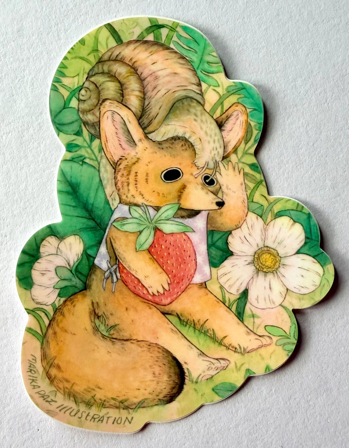 A fox tries to save his strawberry from his friend the snail.
This vinyl matte sticker is weather and waterproof-stick it on a notebook, bike, or car- it's going to stick around! Heck, throw it on a water bottle and through the dishwasher. This sticker can go anywhere. Sticker measures 3.25" x 4.5" Printed in USA.