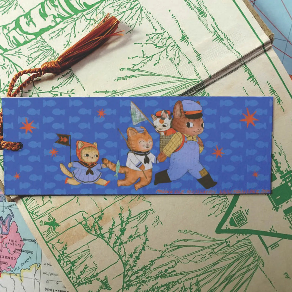 These kitten are out fishing! This bookmark has the same image on both sides.
Printed on heavy cardstock and comes with a tassel, these bookmarks measure 2x6 inches.
Printed in USA