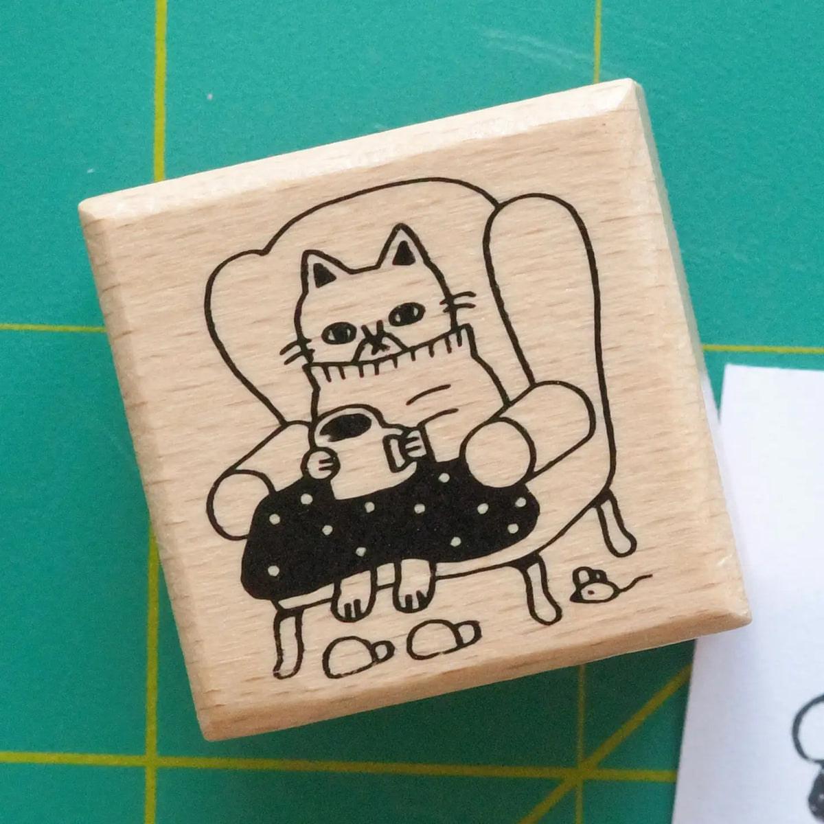 Megan Wang - Cozy Cat Stamp
Decorate your planner or journal with this adorable stamp! Perched on his favorite chair with a cozy blanket and warm mug, this cozy cat is perfect to represent your coziest days.
1 x 1 inch wooden rubber stamp