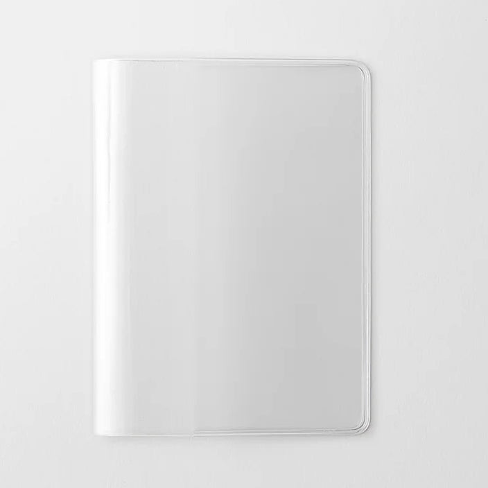 A transparent cover that fits snugly around your MD Notebook
This is a special cover that gently wraps your MD Notebook. The transparent cover protects the notebook from dirt without ruining its appearance.
It subtly protects your notebook from water and dirt without interfering with its characteristics. If you put the cover on with the glassine paper still wrapped around it, the inorganic feel of the vinyl will be softened.
Because it is transparent, you can enjoy the cover design, illustrations, and writ