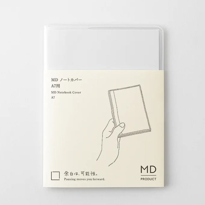 A transparent cover that fits snugly around your MD Notebook
This is a special cover that gently wraps your MD Notebook. The transparent cover protects the notebook from dirt without ruining its appearance.
It subtly protects your notebook from water and dirt without interfering with its characteristics. If you put the cover on with the glassine paper still wrapped around it, the inorganic feel of the vinyl will be softened.
Because it is transparent, you can enjoy the cover design, illustrations, and writ
