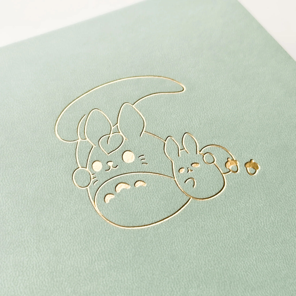 Bunny Spirit Journal in Sage Green with Gold Foil Logo🌱
Product Details:
Size: A5 (5.70 x 8.26 inches)
160 Dotted Grid Pages (5 x 5 mm)
2 Bookmarks
Elastic Band and Pen Holder
Expandable storage compartment