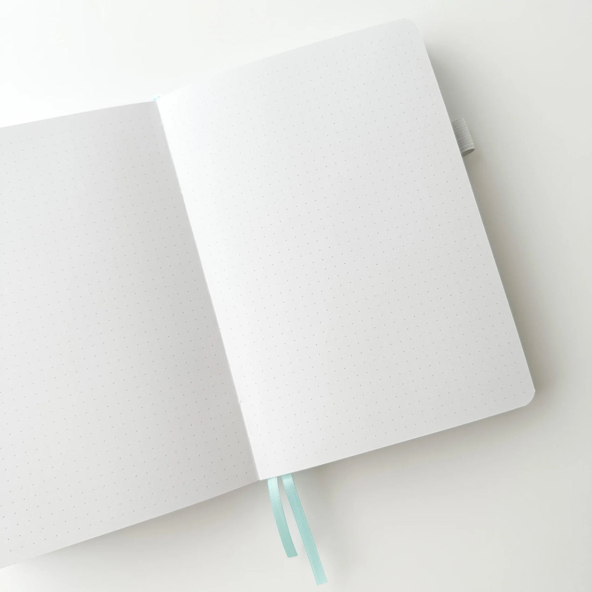 Soft pastel vegan leather bullet journal with delicate gold foil details, made to make your everyday planning feel a little more special ✨
Product Details:
Size: A5 (5.70 x 8.26 inches)
160 Dotted Grid Pages (5 x 5 mm)
2 Bookmarks
Elastic Band and Pen Holder
Expandable storage compartment
