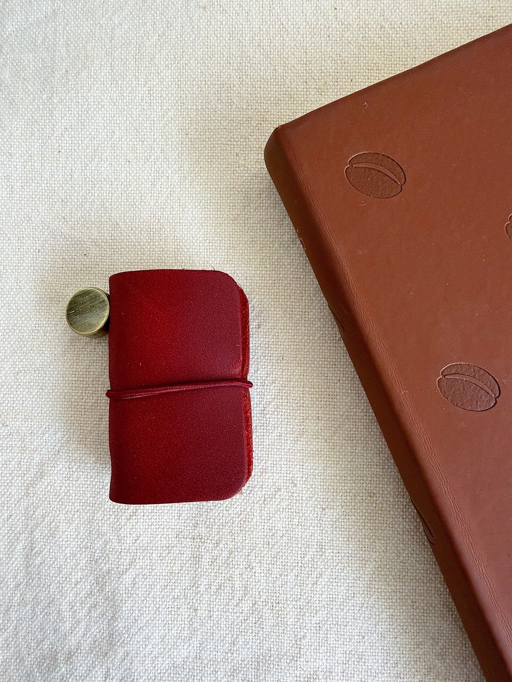 This mini leather journal can be used as a keychain or to keep small notes! There is a tiny notebook inside that is fountain pen friendly. Comes with 1 leather journal - 1 phone charm