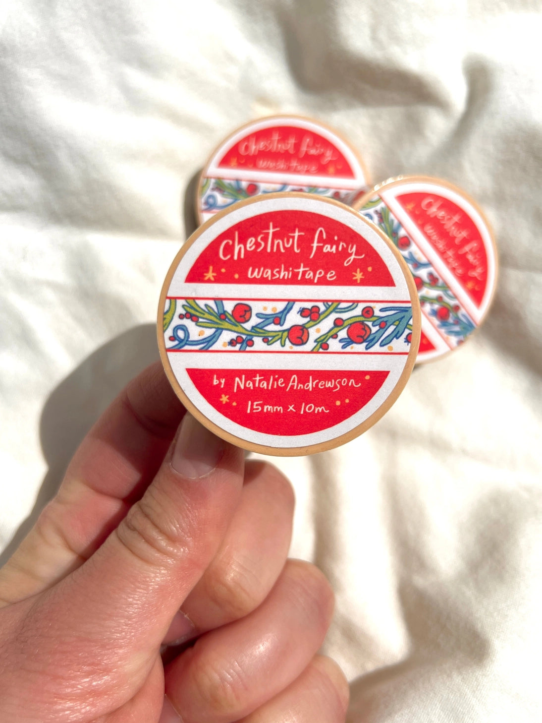 This washi tape was designed from my Chestnut Fairy Riso print! Looks like classic book art decorations with a vibrant red block separating each section.
This roll is 15mm wide x 10m of paper tape. Washi tape is super durable and flexible. It tears easily and can be safely applied to a variety of surfaces; it doesn’t leave a sticky residue behind, making it especially ideal for stationery and hanging prints temporarily.