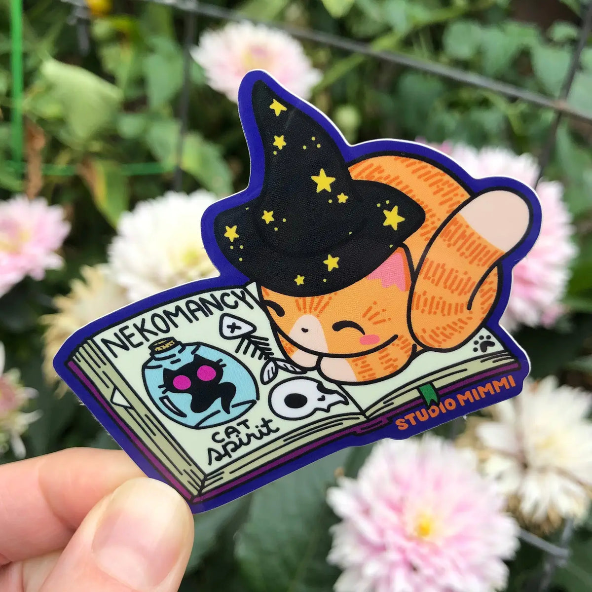 STUDIO Mimi - Neko'mancy Spellbook with Crookshanks Vinyl Sticker
This sticker is designed from one of my Spellbook Cat sculptures with little extra details added; a starry hat, loose page and bookmark.
Sticker Size: 2.9” x 2.8”
Printed on a white premium adhesive film with a glossy weather resistant laminate for a 2-4 year minimum outdoor life.
Printed on a PVC-free film that’s environmentally friendly.
