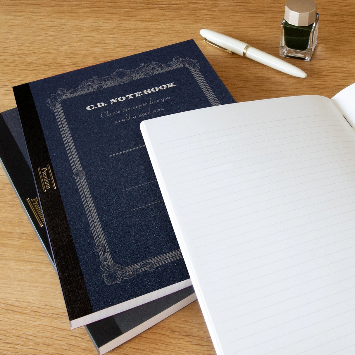 High-quality notebooks are ideal for jotting down ideas, taking notes, sketching, making lists and more. They are perfect for use at home or the office.
Contains silky white, acid free paper that allows for effortless writing.
Notebooks available in ruled, grid and plain paper options.
Heavy duty covers feature a glitter accent.
Silver and gold foil text on the cover also decorate this upscale notebook.
Sturdy thread binding allows the notebook to lay flat for comfortable writing.
Red threading matc
