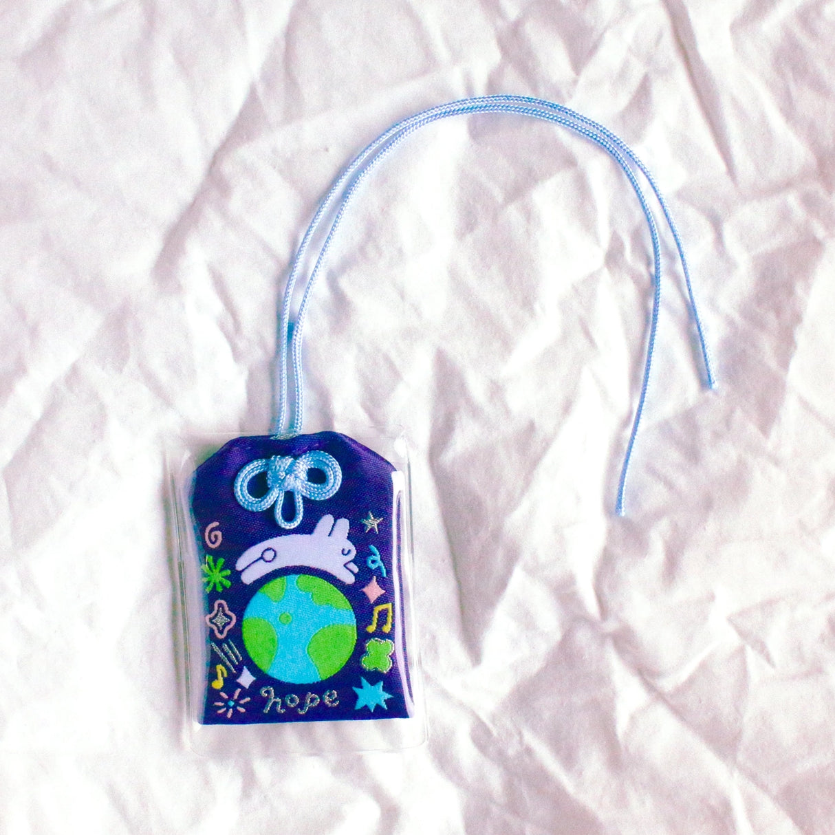 2x2.5 omamori charm with a 8 inch string.
An omamori is a Japanese charm that provides protection and luck!
