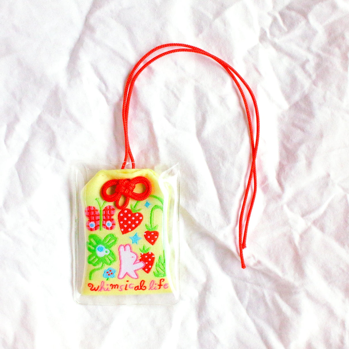 2x2.5 omamori charm with a 8 inch string.
An omamori is a Japanese charm that provides protection and luck!