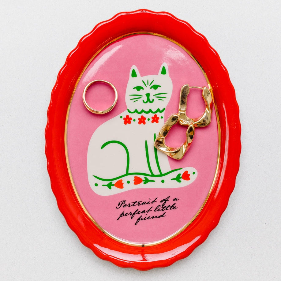 What better way to keep your cat from knocking trinkets off the table than with this adorable trinket tray? It’s got shiny gold accents but also scalloped edges to keep boop-able bobs safely in their place. Plans foiled, Whiskers. *Kisses forehead* 