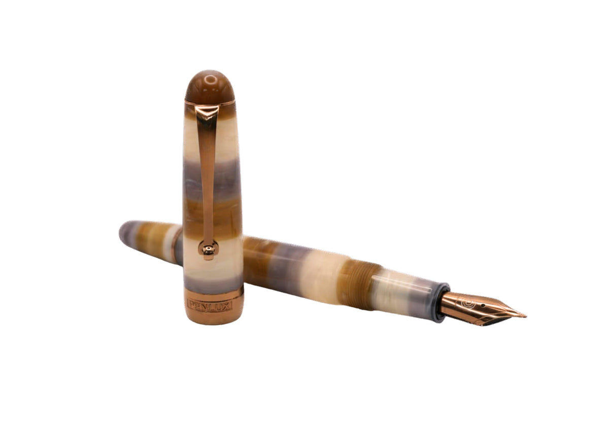 Penlux Masterpiece Delgado Bumblebee Fountain Pen
The collection of Delgado Selected is a premiere version of the Delgado which uses only rare materials and with small production quantity. The Bumblebee was created using PMMA resin and only 70 pieces were produced.
The Bumblebee Delgado features an earthy style with banded swirls of smoky slate grey, translucent honey amber, creamy white, and deep caramel. Topped off with copper plated trim and nib, it looks less like a bug and more like