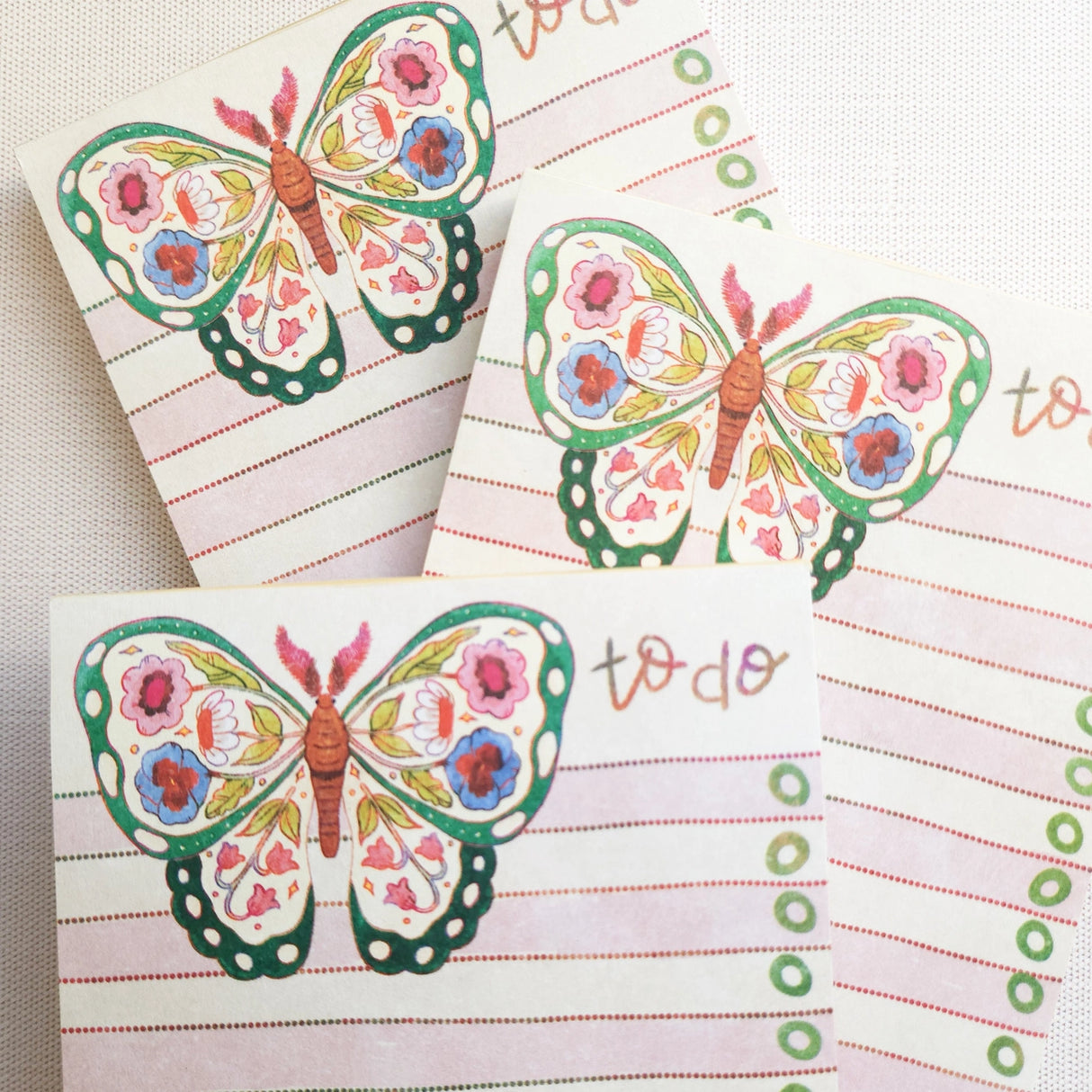 In the gardens of Wildflower Woods, a butterfly drifts from bloom to bloom, wings patterned with flowers gathered along the way. This notepad brings that light, floral moment to your desk, making everyday lists feel a little more inviting.
Designed to be practical without feeling busy, this notepad offers a simple, cheerful way to keep track of daily to-do lists and planning.
