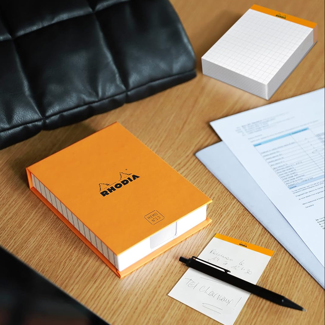 Beautiful, practical and functional, this Memo pad has it all. With its false air of a stapled block, it is always at hand on your desk.
Comes in a refillable protective box.
Size: 3 3/8" x 4 1/2"
Detachable Sheets: 240
Paper/Color: 80g/Ultra White
Fountain pen and marker friendly
Exceptionally smooth, acid-free, pH neutral
Cardboard backed, nonskid backing