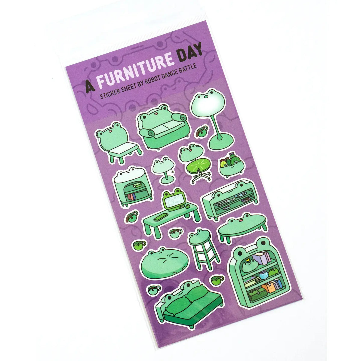 This is part of a new series of sticker sheets that feature different "days".
There are 20 individual stickers on the sheet full of frog furniture.
They are vinyl stickers on a clear plastic sheet with a backing card.
The whole packaging is 3.8 x 8.75" and is ready to hang.
The sticker sheet is 3.75 x 5.8"