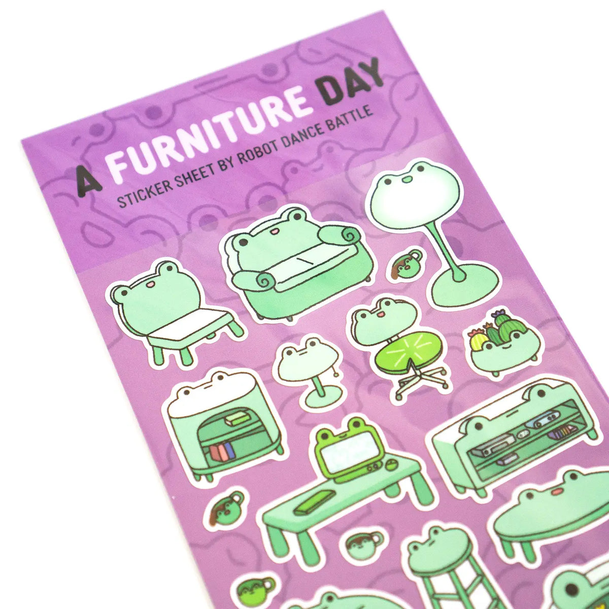 This is part of a new series of sticker sheets that feature different "days".
There are 20 individual stickers on the sheet full of frog furniture.
They are vinyl stickers on a clear plastic sheet with a backing card.
The whole packaging is 3.8 x 8.75" and is ready to hang.
The sticker sheet is 3.75 x 5.8"