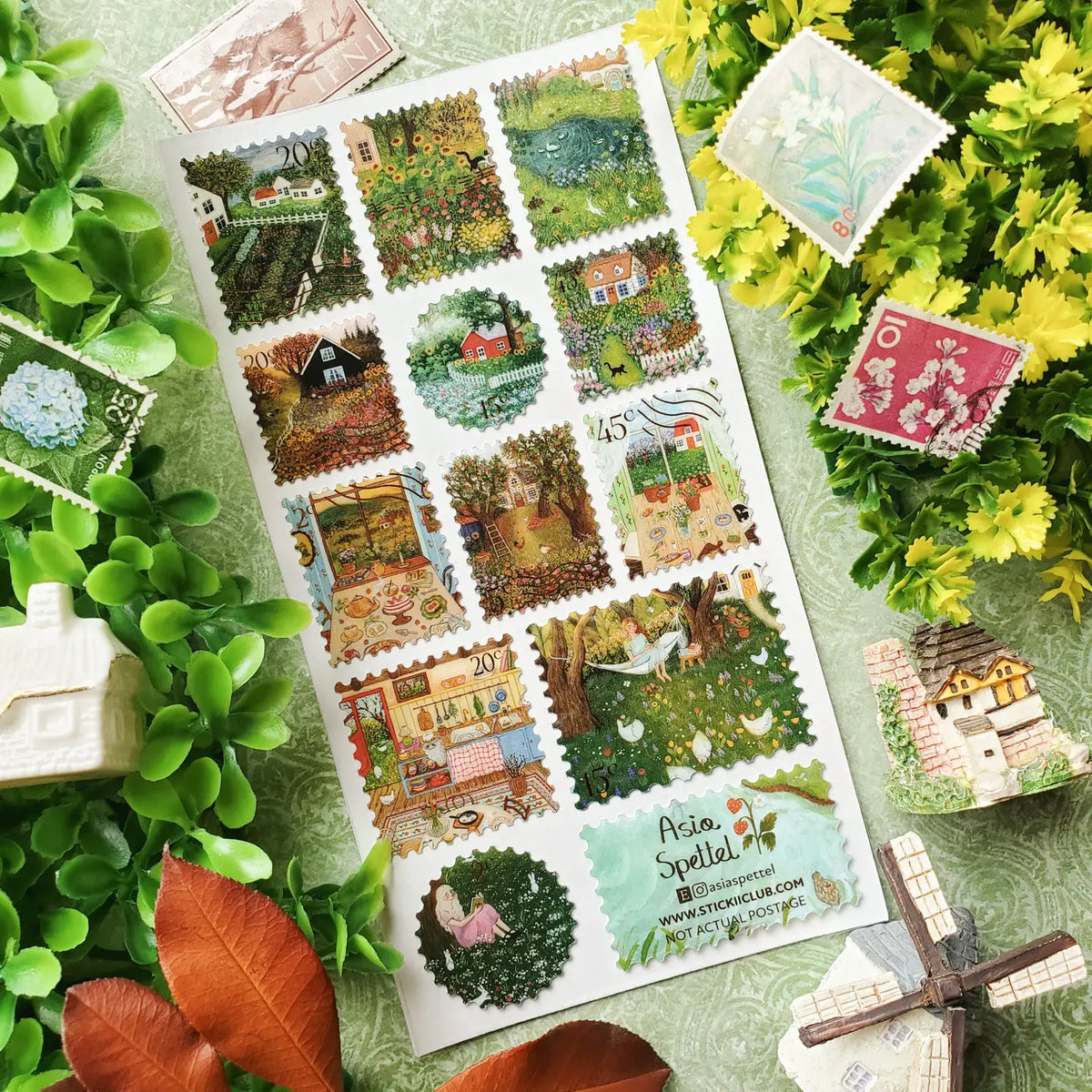 🌷🏡 In @asiaspettel’s countryside, every path seems to lead somewhere peaceful and blooming. Wander past cottage gardens bursting with flowers, sunny kitchens filled with homemade treats, quiet orchards, and cozy corners made for reading beneath the trees. With soft colors and beautifully detailed scenes, this sheet captures the gentle magic of country living.
Art by: @asiaspettel
One sticker sheet is included.
• Top Coating: Gold foil
• Adhesive Layer: PVC (plastic)
• Backing Layer: Clear PET
• 6.69"x3.