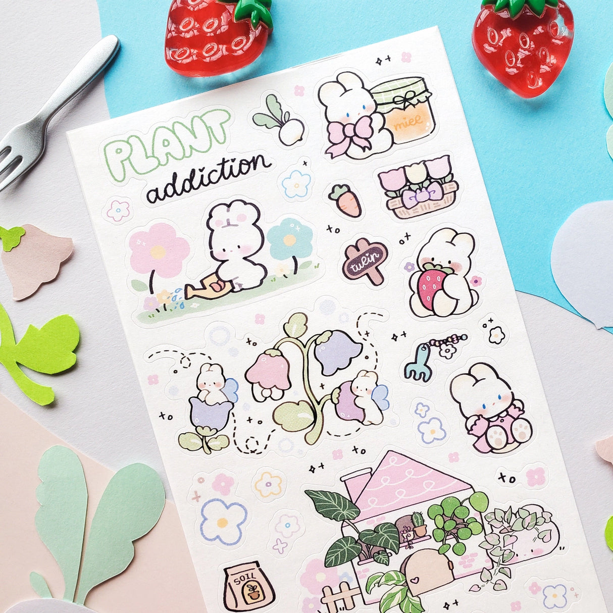 🌱🐰 In @memiartt’s cozy little plant paradise, bunny gardeners nurture with love, muddy paws, and lots of happy hops! From cuddling flowers and mixing soil to watering sprouts, potting leafy friends, and sneaking carrot snack breaks, these bunnies are always busy growing something wonderful that makes this sheet burst with garden magic!
Art by: @memiartt
Top Coating: None
Adhesive Layer: Paper
Backing Layer: Paper
6.69" x 3.54".
Weight - 0.03lbs.
1 sheet included