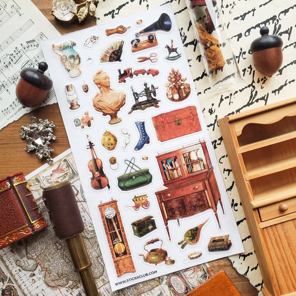 STICKII - Treasured Antiques Sticker Sheet
🕰️🧳 Brimming with timeworn treasures, this sheet feels like a quiet afternoon spent wandering through an antique shop. From ornate clocks and old sewing machines to travel trunks, violins, gramophones, and carefully kept curios, each piece captures the charm of objects with a story to tell. Perfect for adding a little old-world elegance, mystery, and nostalgia to your pages.
Top Coating: None
Adhesive Layer: Paper
Backing Layer: Paper
6.69" x 3.54".
Weight - 0.