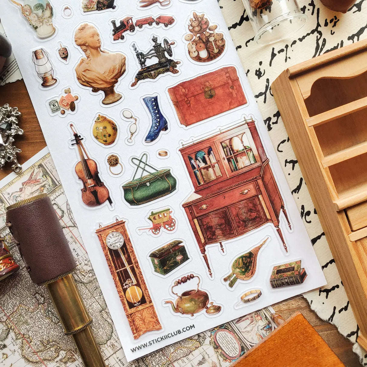 STICKII - Treasured Antiques Sticker Sheet
🕰️🧳 Brimming with timeworn treasures, this sheet feels like a quiet afternoon spent wandering through an antique shop. From ornate clocks and old sewing machines to travel trunks, violins, gramophones, and carefully kept curios, each piece captures the charm of objects with a story to tell. Perfect for adding a little old-world elegance, mystery, and nostalgia to your pages.
Top Coating: None
Adhesive Layer: Paper
Backing Layer: Paper
6.69" x 3.54".
Weight - 0.