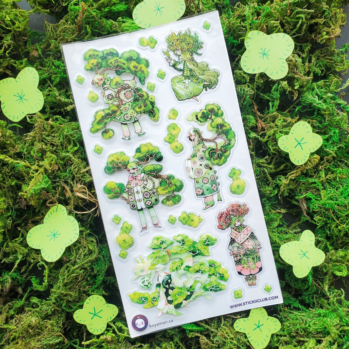 🌳🍃 Get ready to branch out with @maruti_bitamin’s bonsai beauties and leafy legends! These stylish forest guardians rock living tree crowns, flowing robes, and nature magic like it’s the hottest green trend of the season. Rooted in charm and bursting with botanical flair, this set is ready to sprout some serious wow on your pages!
Art by: @maruti_bitamin
Top Coating: None
Adhesive Layer: PVC (plastic)
Backing Layer: Clear PET
6.69" x 3.54".
Weight - 0.03lbs.
1 sheet included 