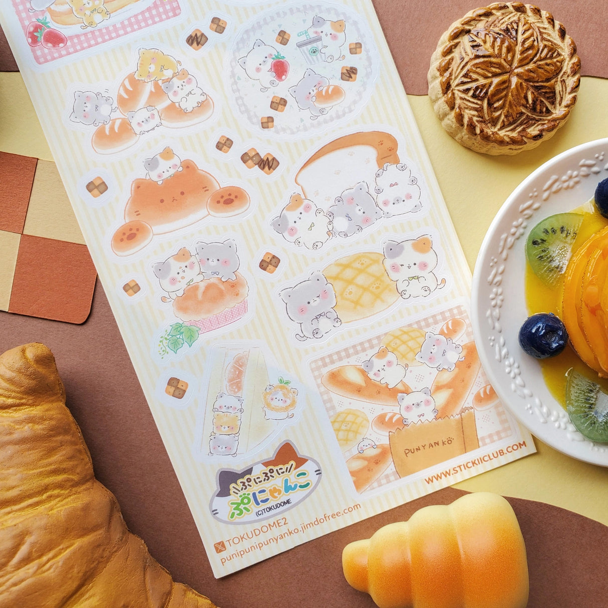 🍞🐱 Soft, sweet, and baked with pure cuteness! @illustratortokudome’s kawaii kitties are lounging on fluffy pancakes, snuggling in fresh baguettes, and baking like purr-fect pros. Every buttery pastry and sugar-dusted treat comes with a tiny paw print of charm.
Art by: @illustratortokudome
Top Coating: None
Adhesive Layer: Paper
Backing Layer: Clear PET
6.69" x 3.54".
Weight - 0.03lbs.
1 sheet included 