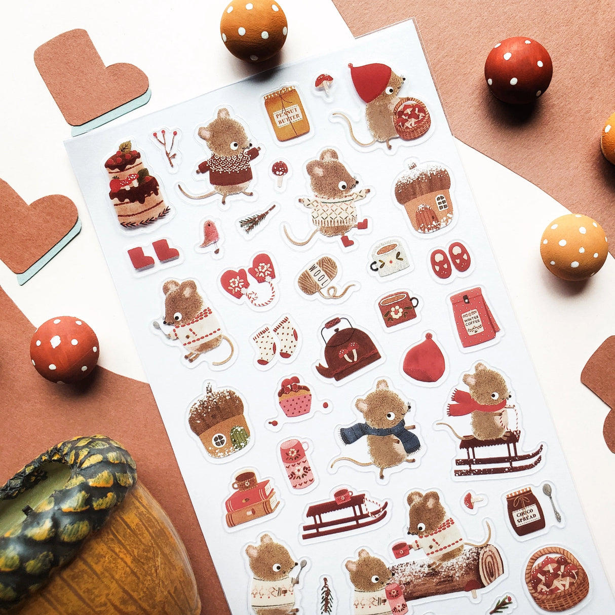 🐭☕️ Cozy up with @nettleandtwig’s snug little mouse village, where winter days are filled with woolly sweaters, steaming cocoa, and muffins fresh from the oven! Among snow-dusted acorn cottages, these tiny friends spend their time sledding, knitting, and sharing warm moments by the fire.
Top Coating: None
Adhesive Layer: PVC (plastic)
Backing Layer: Clear PET
6.69" x 3.54".
Weight - 0.03lbs.
1 sheet included 