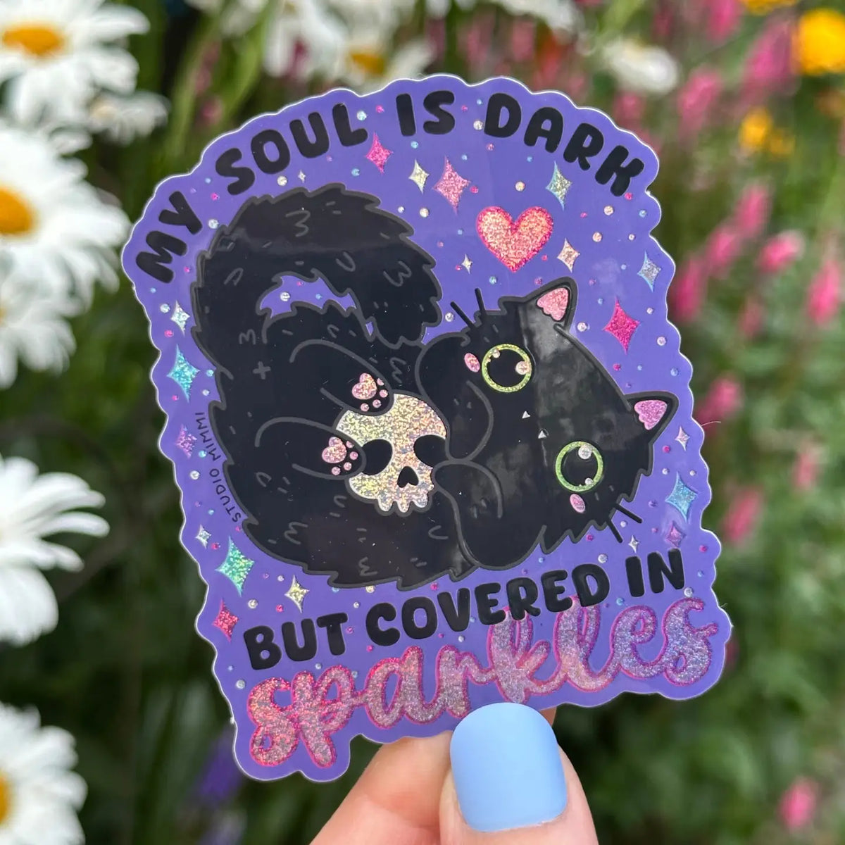 STUDIO Mimi - My Soul Is Dark But Covered in Sparkles Vinyl Sticker
I said, “my soul is dark, but covered in sparkles” to a friend and they exclaimed, “That needs to be on a sticker!” Hahaha, so here it is!
Couldn’t have a sticker design like this without a black cat and glitter holo! Even the toe beans are sparkly!
Weatherproof vinyl with glitter holographic details.
Size 2” x 3” (inches)