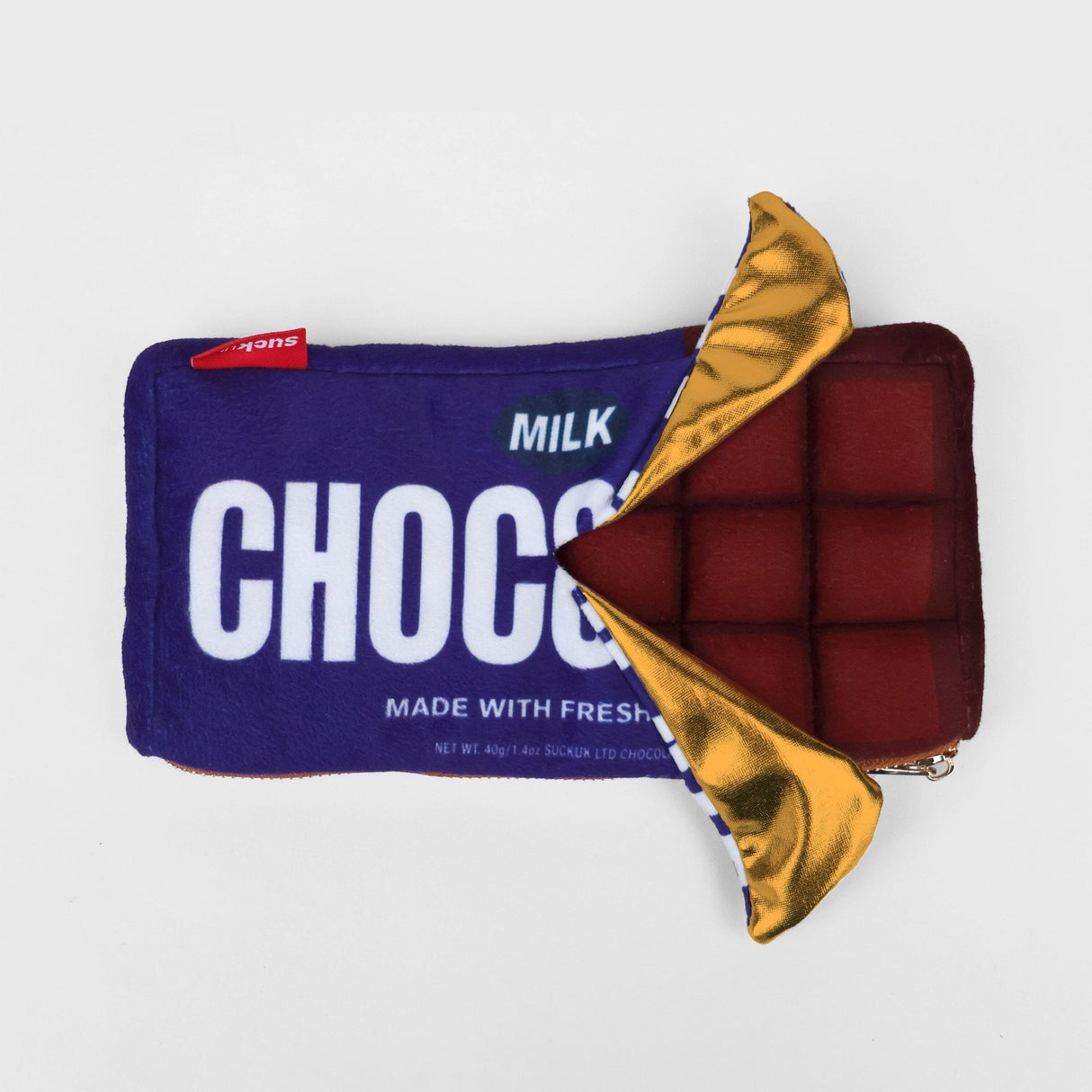 Plush chocolate bar shaped case with gold zip. Store your belongings in style by tucking them into this sweet treat. Yum!
Juicy, tasty, sweet and sour. And very cute. Stuff your stuff into something soft, and squishy. Delicious looking plush zip pouches look like foodie treats but instead of calories, they hold your everyday essentials. From cheesy slices to sickly treats, each pouch is designed to be irresistible and practical. Perfect for pens, cables, cosmetics, or whatever bits and bobs you need to sta