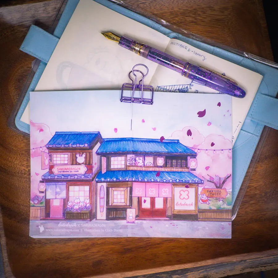 Sakuradragon - Sakura Street Shopfronts Postcard
A souvenier to send your friends from Sakura Street!
4x6" illustration postcard printed on 15pt card stock paper.
Satin matte finish.