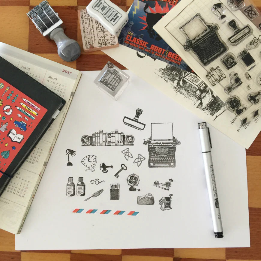 Need a little flavor to your style or possibly some small inspiration? Then the HST™ On My Desk Collection Stamps will be perfect for you. HST is where the details matter!!!
Product: Clear stamp
Size: Approximately 4 x 6 inches