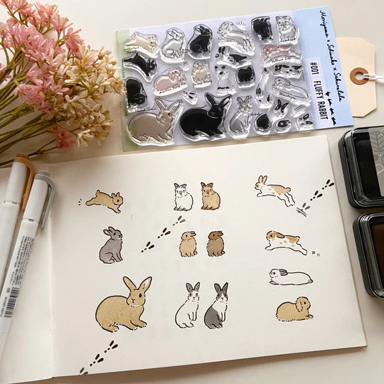 This collaboration with Moriyama, who has a wonderful shop in Ota Ward, Tokyo, and Shiko Moriyama, an illustrator who draws adorable rabbits.
"Fluffy Rabbit" is a clear stamp in the style of a rabbit's encyclopedia. It is divided into 10 types of rabbit base outline stamps, such as Netherland Dwarf, Holland Drop, and Flemish Giant, and coloring stamps that serve as patterns. You can stamp it in any color you like, so if you have a rabbit in your family, please try stamping it in the color of "my child"!