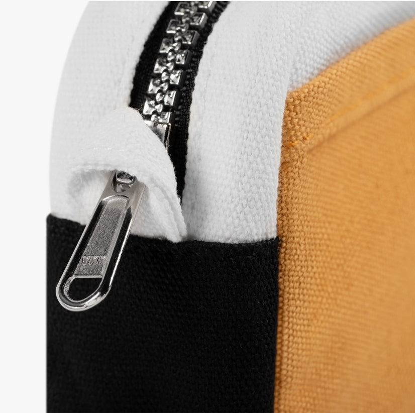 A compact carry-all pouch for artists, makers, and stationary lovers who appreciate a little order in their chaos. Structured enough to hold its form, soft enough to fit anywhere, and fully machine-washable for the days that get a little messy — your tools, pens, and creative essentials stay safe, visible, and ready wherever you go.
Inside, 20 pockets make space for art supplies, stationary essentials, and an A5 notebook, all secured by a smooth YKK zipper. Sized to fit within larger bags or carry on its o