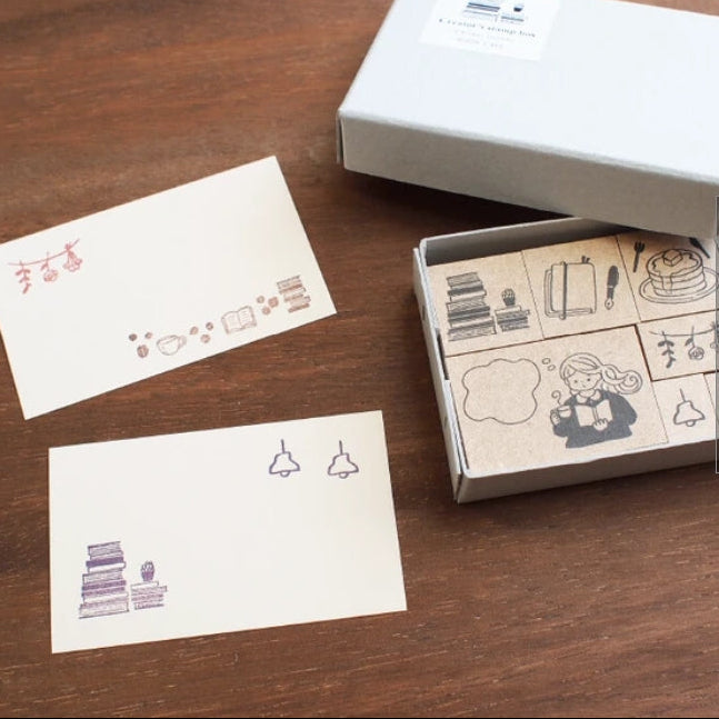 Step into a cozy world of creativity with the Creator’s Stamp Box – Book Café from Stamp Marche and Sonomi Kogei. This charming set brings together beautifully illustrated stamps inspired by warm café moments, books, and everyday comforts—perfect for adding personality to journals, planners, scrapbooks, and handmade cards.
Each stamp is crafted with a solid wooden mount and high‑quality rubber, giving you crisp, clean impressions every time.
This set includes 8 stamps.
Stamp size: approx. 