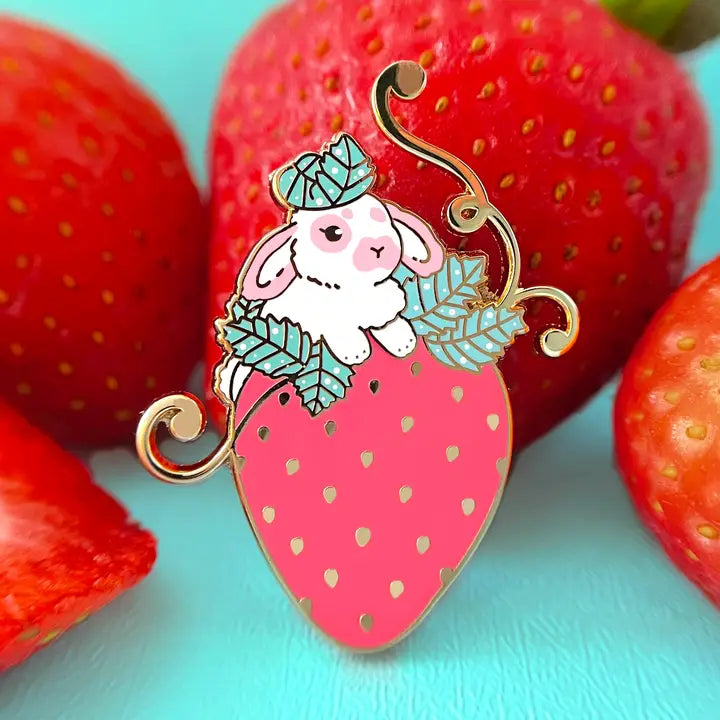 This little bunny is having a blast playing around in a strawberry patch. The perfect strawberry was chosen out of the bunch.
✦ Hard enamel
✦ Shiny gold metal
✦ 1.50 inches
✦ 2 Posts for extra security
✦ Rubber backings
✦ Back stamped for authenticity
Comes packaged on a backing card.