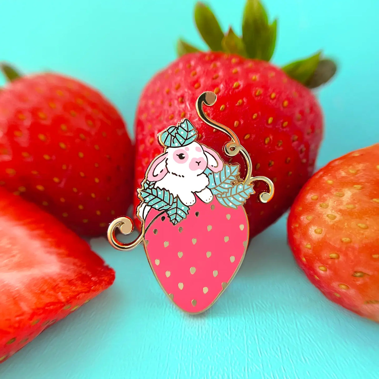 This little bunny is having a blast playing around in a strawberry patch. The perfect strawberry was chosen out of the bunch.
✦ Hard enamel
✦ Shiny gold metal
✦ 1.50 inches
✦ 2 Posts for extra security
✦ Rubber backings
✦ Back stamped for authenticity
Comes packaged on a backing card.
