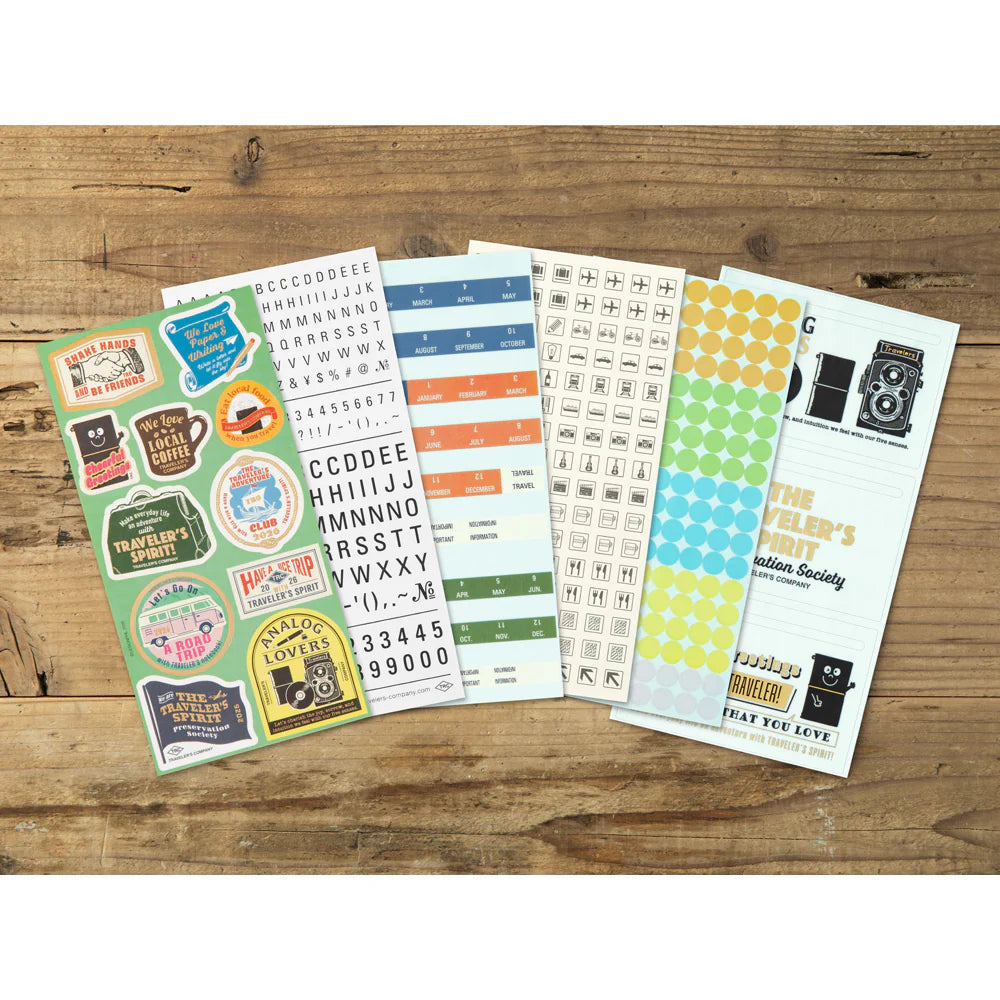This is a sticker set for customizing TRAVELER’S notebook that makes it more fun, including index and pocket stickers, icon stickers to represent different plans, dry transfer, and stickers to decorate the cover. The 2026 version features a design with a theme of “TRAVELER'S SPIRIT"
You can customize the cover of the 2026 diary or other notebooks with stickers of analog motifs. Have a good trip with THE TRAVELER'S SPIRIT in 2026.