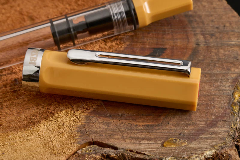 TWSBI ECO Bahama Yellow Fountain Pen
Comes in EF, F, M, B, Stub1.1 nib choices
Colors: Yellow/Clear
Pen cap is able to post onto the back of the pen
Piston Filler Fountain pen.
Simply unscrew the end cap, dip into ink, screw back the end cap, and your done! Ready to write!!