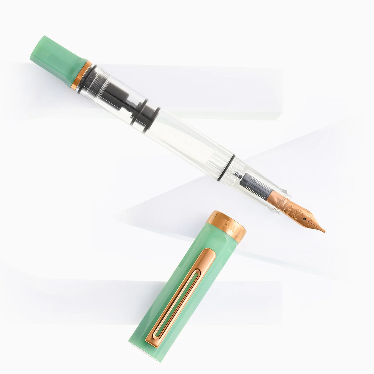 TWSBI ECO Jade Jelly w/ Bronze Fountain Pen
The Jade Jelly TWSBI eco features a lovely milky looking green that nicely matches its name. The jade coloring is offset with polished bronze trim and nib. Its piston-filling system and smooth steel nib deliver a consistent, enjoyable writing experience for journaling, note‑taking, and everyday use.
Featuring a cream-and-clear resin body with bronze trim, this pen’s transparent barrel lets you monitor ink levels while showcasing TWSBI’s precision piston mechanis