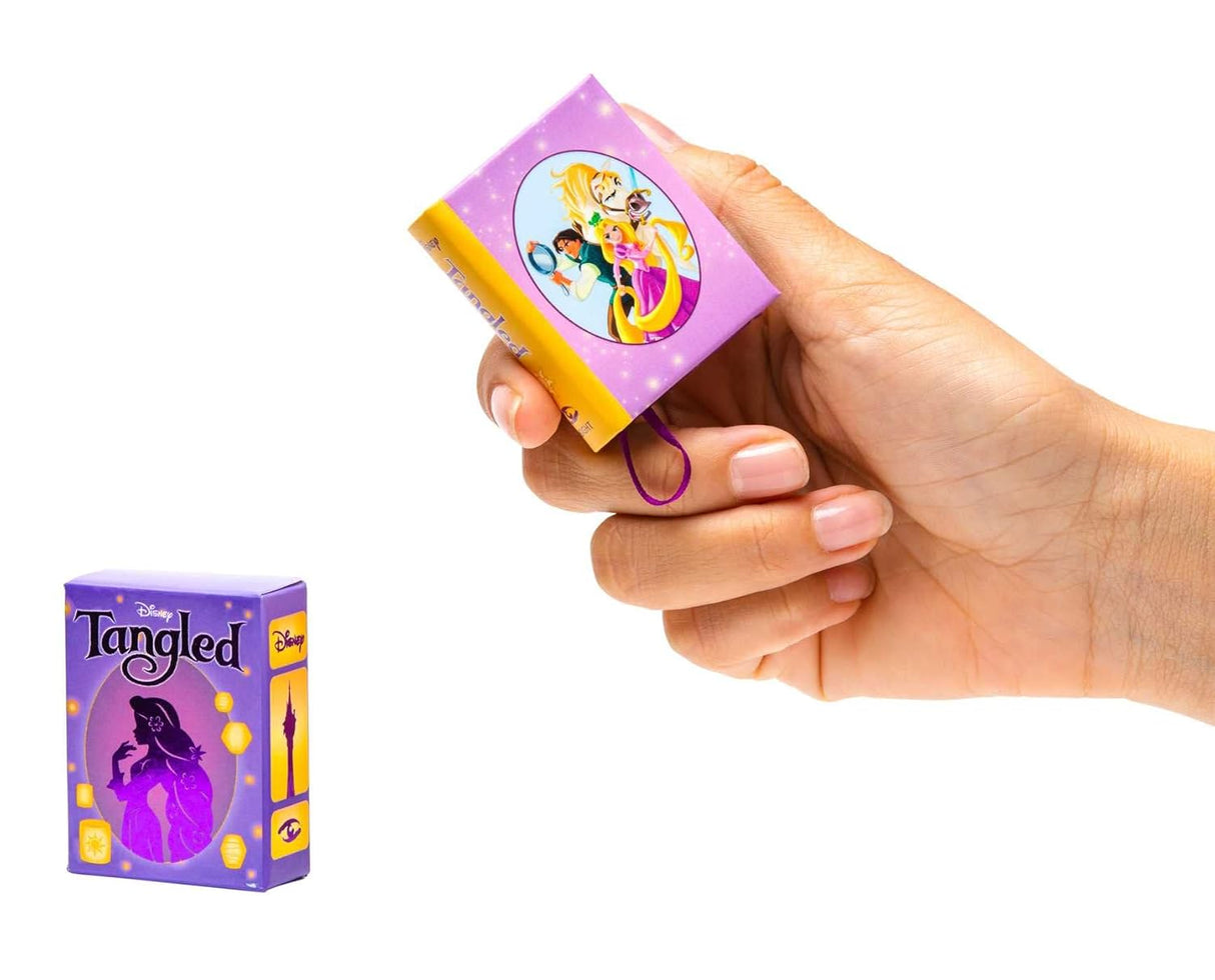 One of Disney’s modern animated classics, Tangled instantly charmed audiences with its lovable characters, beautiful music, and gorgeous animation, and new telling of the classic fairy tale, Rapunzel. Now, fans can keep the beloved fairy tale close to their hearts with this pocket-size storybook retelling of the iconic film, illustrated with art and imagery pulled straight from the screen.
Part of Insight Editions’ ongoing series of miniature storybooks based on popular Disney films, this tiny book is a un