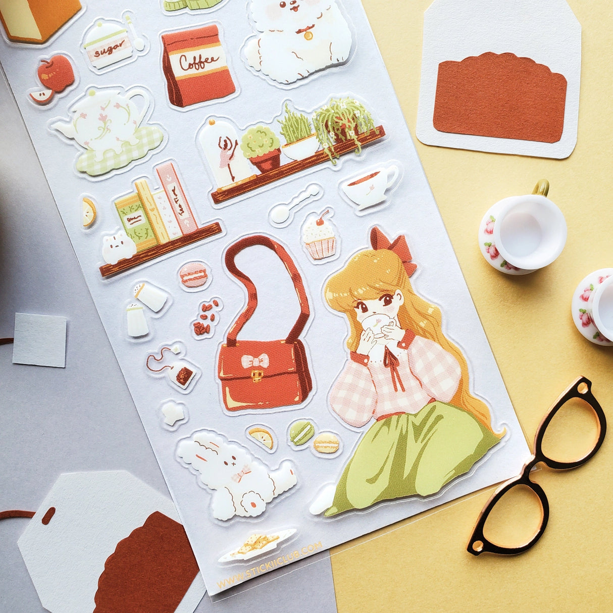 ☕🎀 Set the kettle on and settle in for the sweetest tea time daydream. This pastel-perfect sticker sheet is filled with gentle tea breaks, clinking cups, sugar-dusted treats, and all the little comforts that make staying in feel special. From quiet sips and happy snacks to fluffy pups keeping you company and bows tucked into every cozy corner, each sticker captures that warm, unhurried feeling of tea time when the world softens, the tea stays hot, and everything feels just right.
Art by: Aanchal