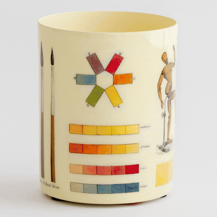 Handmade by skilled artisans, this decorative The Art of Colouring Enamel Everything Pot features artwork reproduced from a book about the art of colouring and painting landscapes in watercolours first published in 1805. Filled with colour swatches, artist studies, and drawing references, the design offers a fascinating glimpse into the tools and techniques used by early 19th-century painters and illustrators.
This food-safe enamel pot is wonderfully versatile—use it to hold pens and pencils, paint brushes
