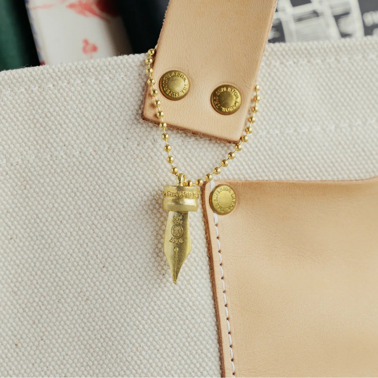 A Fountain Pen Nib Charm: Carried with Meaning
A solid brass charm meticulously shaped in the likeness of a classic fountain pen nib. Every intricate detail is beautifully captured, complete with the inspiring engraved message, "The Pens Will Be With You Always."
Equipped with a sleek ball chain, it attaches effortlessly to your bags, pouches, or key rings. Despite its petite size, it brings the distinct, rich texture and unmistakable presence that only genuine brass can provide.
As you use it, the brass