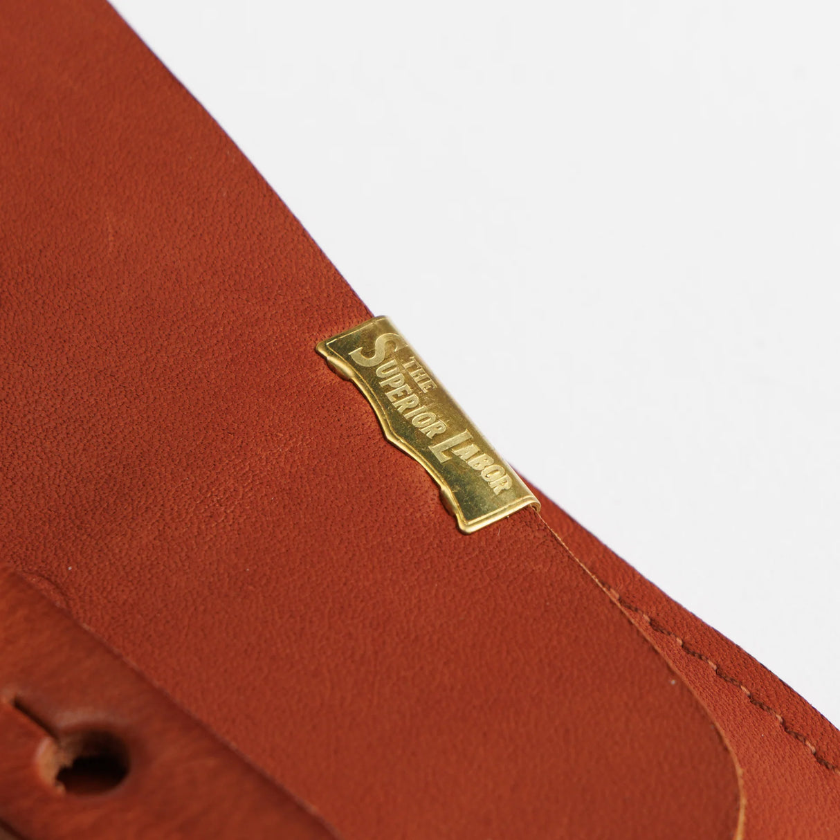 The SUPERIOR LABOR Glove Leather - Tool Holder
The discontinued tool holder is back with a redesigned construction.
The raw-cut edges are accented with a brass tag, and the interior logo is finished with gold foil. The result is a refined, elegant look that still feels light and airy. It’s perfect for carrying pens and other everyday tools.
Size: W10.5×H15.5×D2cm
About the Leather – Japanese Glove Leather
Made from durable and supple Japanese glove leather, known for its lightness and str