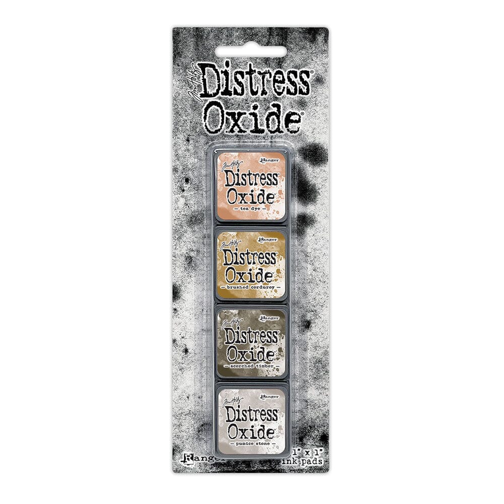 Tim Holtz Distress Mini Oxide Ink Pads are a collection of 1 x 1 cubes featuring water-reactive dye & pigment ink fusion that creates an oxidized effect when sprayed with water.