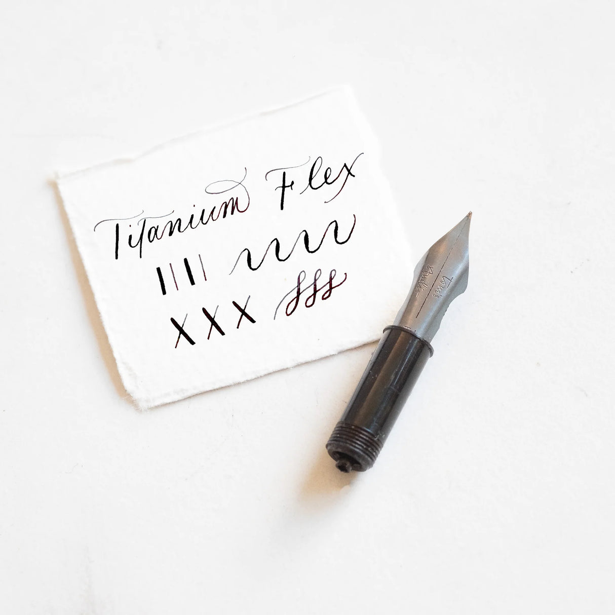 This beauty is the ultimate flex – softer than stainless steel nibs and wonderfully responsive. It’s perfectly paired with our fountain pens for practising calligraphy, whether you’re at home or on the go, with no need for prepping nibs or ink.
Crafted from titanium, this nib is virtually indestructible, promising decades of reliable writing. It’s the best flex nib for those who want expressive lines with minimal maintenance.
Made exclusively for our fountain pens, every nib is interchangeable, allow